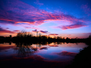purple sunset above river
