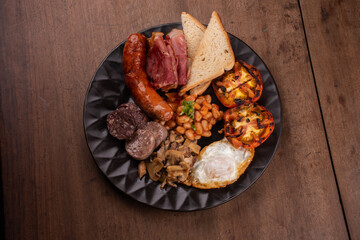 english breakfast irish uk with plenty of protein sweet beans sausage bacon egg mushrooms top view