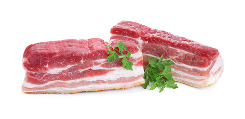 Pieces of raw pork belly and parsley isolated on white