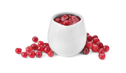 Cranberry sauce in pitcher and fresh berries isolated on white
