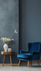 blue armchair and wood table against grey wall