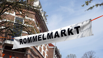 Netherlands, banner with the text "Rommelmarkt" at the Dutch flea market (garage sale) on celebration day Kingsday (Koningsdag) every year on April 27th
