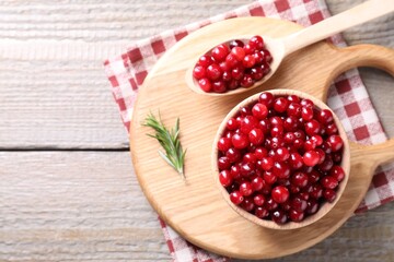 Fresh ripe cranberries on wooden table, top view
