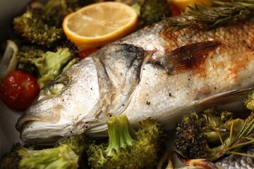 Delicious fish with vegetables and lemon, closeup