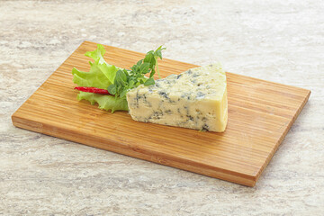 Blue cheese piece over board