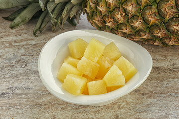 Marinated pineapple slices in the bowl