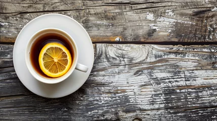 Zelfklevend Fotobehang Hot Earl Grey tea with lemon slice on top. © Ghazanfar