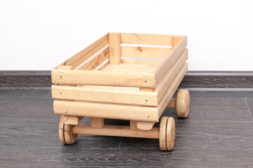 Little red farm wood wagon isolated on white background. This has clipping path