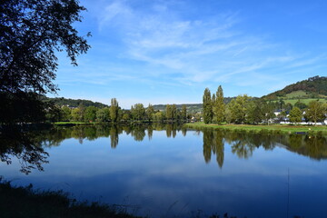 Fototapeta na wymiar mirror calm reservoir of river Our / Sauer
