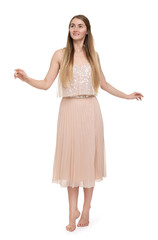 Naklejka premium Beautiful girl in beige skirt on white background