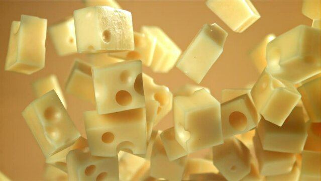 Super slow motion pieces of cheese on black background. Filmed on a high-speed camera at 1000 fps. High quality FullHD footage