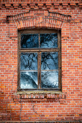 Window in old red brick building 