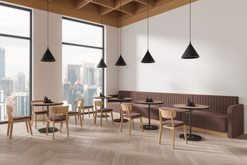 Cozy restaurant interior with chairs and tables in row, eating space and window