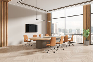 Cozy conference interior with table and chairs, tv screen and panoramic window