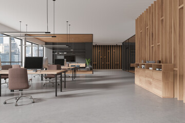 Stylish office interior with coworking and meeting room near panoramic window