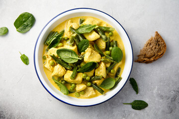 Homemade chicken curry with spinach and pea