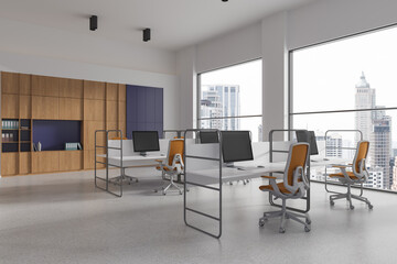 Naklejka na ściany i meble Stylish office interior with pc monitors on table and shelf, panoramic window