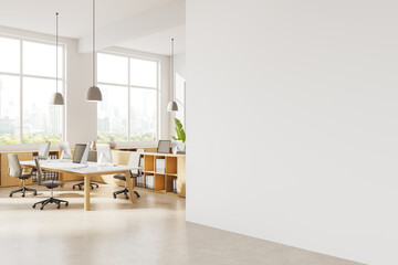 Modern white coworking office corner with blank wall