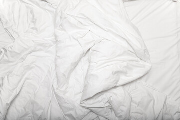 Morning time, messy, crumpled used white blanket on a bed, top view - 744510689