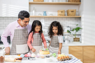 Obraz na płótnie Canvas Portrait of enjoy happy love asian family father with little asian girl daughter child play and having fun cooking food together with baking cookie and cake ingredient in kitchen