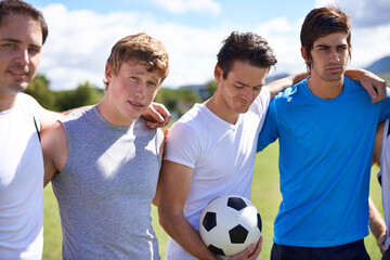 Soccer, men and hug together on field for portrait at game with fitness, exercise and wellness in...