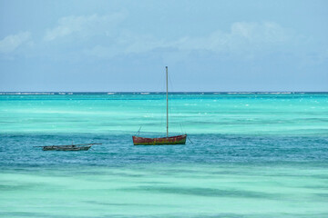 Obraz premium Scenic view of moored boats at Jambiani beach, Zanzibar