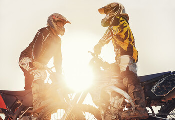 Sport, racer or people on motorcycle outdoor on dirt road with relax after driving, challenge or competition. Motocross, lens flare or dirtbike driver or friends on offroad course or path for sunset - obrazy, fototapety, plakaty