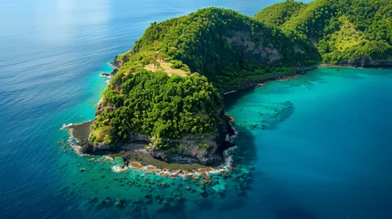 Fotobehang Aerial view of a volcanic island surrounded by turquoise waters. © John