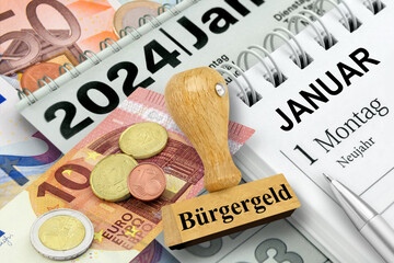 Deutscher Mindestlohn 12,41 Euro und Stempel Bürgergeld  Kalender Datum 1. Januar 2024 - obrazy, fototapety, plakaty