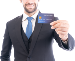 A confident businessman in a suit extends a credit card, implying trustworthiness and financial dealings.
