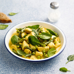 Homemade chicken curry with spinach and pea