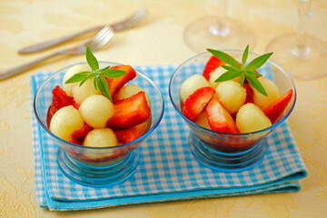 Strawberries and melon with lemon verbena.