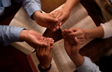 Three men pray together, gratitude, trust, and friends in a circle pray together for religion,...