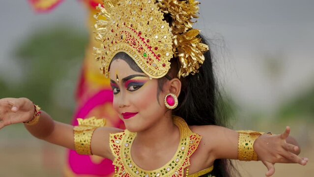 female balinese dancer wearing gold prada, cultural performance, indonesian culture