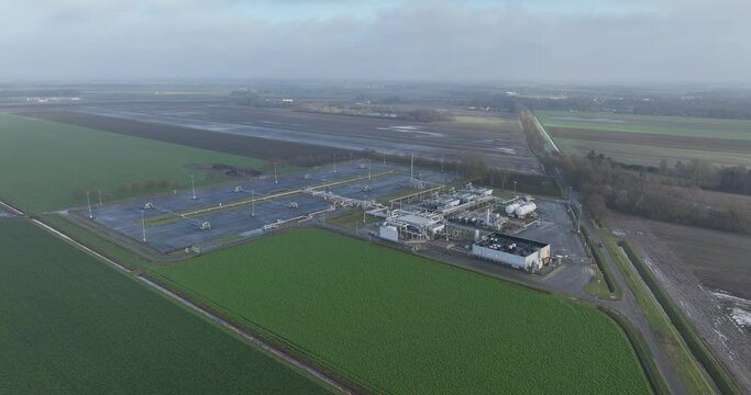 Natural gas field and extraction facilities near SLochteren in Groningen, The Netherlands. Causing earthequakes and damage to the population and residential living in the area. Aerial birds eye view.
