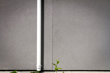 Modern gray plaster street wall