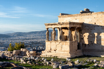 Porch of the Caryatids with city view of Athens in the background
