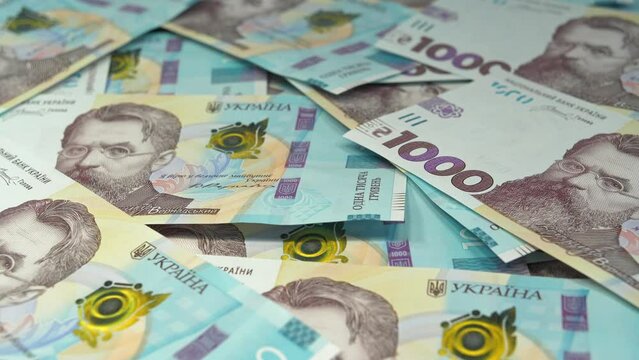 Banknotes 1000 Hryvnia. Ukrainian banknotes of one denomination. Real Ukrainian paper money of blue  yellow color. International currency. Monetary policy. Global trade
