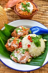 steamed fish with curry paste with rice, thai called Ho mok