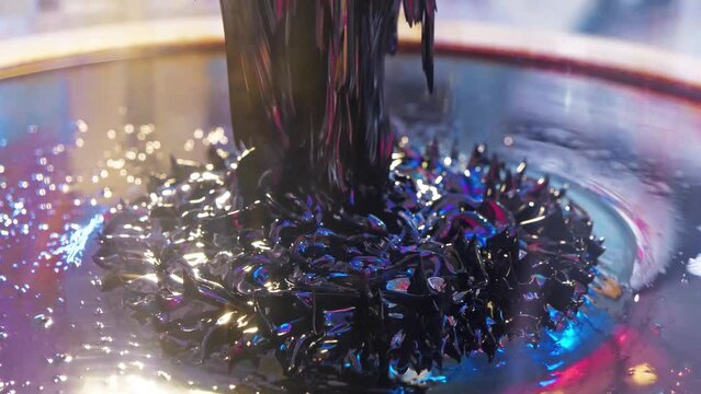 Ferromagnetic fluid. Viscous ferrofluid spike-like shape. Ferromagnetic fluid creates amazing drawings spikes in magnetic field, appearing and disappearing. Real ferromagnetic fluid in action