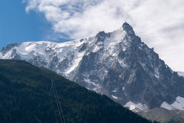 Fototapeta na wymiar The Aiguille du Midi, a 3,842-metre-tall mountain in the Mont Blanc massif within the French Alps, popular tourist destination accessible by cable car from the centre of Chamonix, Haute Savoie, France
