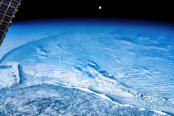 Moonrise over a frozen Hudson Bay, Canada. Digital enhancement of an image by NASA