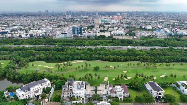 aerial view of a residential area in North Jakarta, Indonesia with a Lake and Golf Course and the highway to the Airport