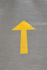 Yellow arrow indicating direction for traffic
