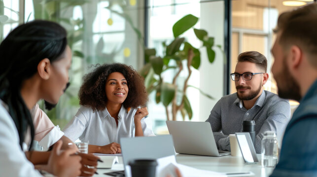 Multicultural Tech Experts Collaborating in Bright Workspace