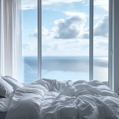 Close-up of a bedroom with disheveled white bedding, offering a view of a serene seascape through a large window