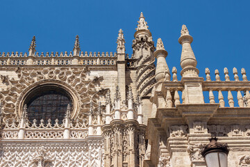 exterior architecture of Cathedral church in Seville, Spain - 744583262