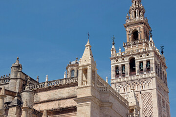 exterior architecture of Cathedral church in Seville, Spain - 744583457