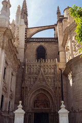exterior architecture of Cathedral church in Seville, Spain - 744583683