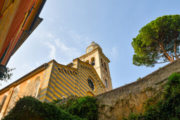 Low-angle view of the church of Divo Martino (12th c.), dedicated to St. Martin of Tours and located in the historic centre of the old fishing village, Portofino, Genoa, Liguria, Italy